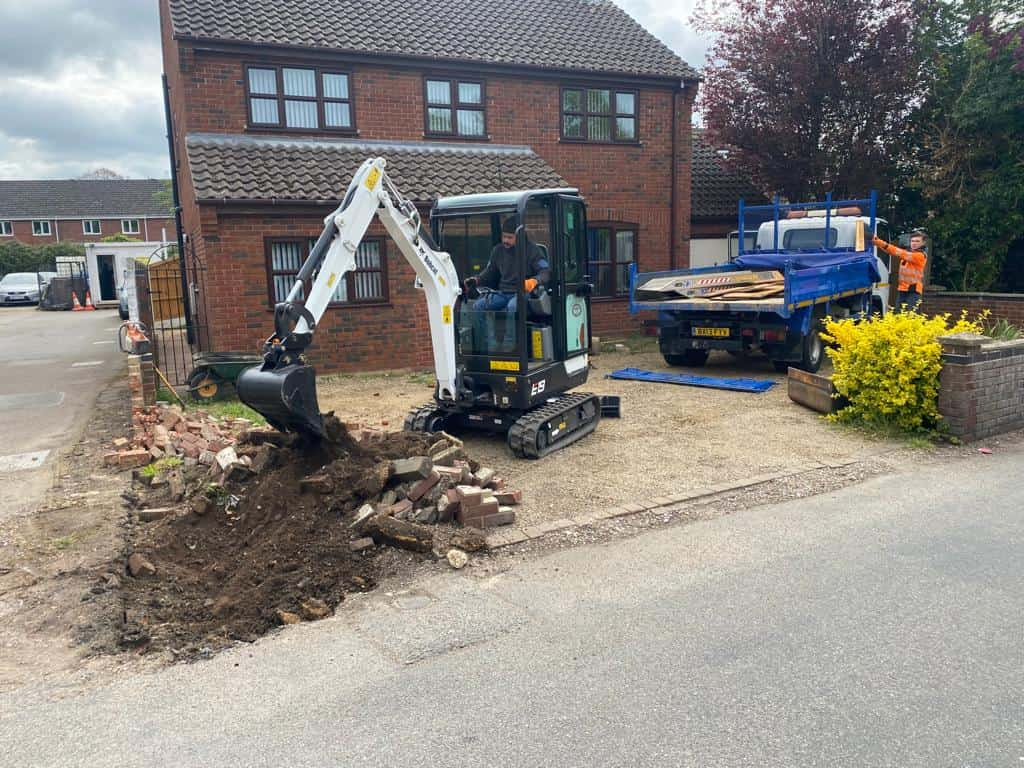 This is a photo of an operative of Newmarket Driveway Surfacing Digging out for a new tarmac driveway